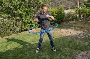 Xander plays with the hoop. Photo by Jeff Koga